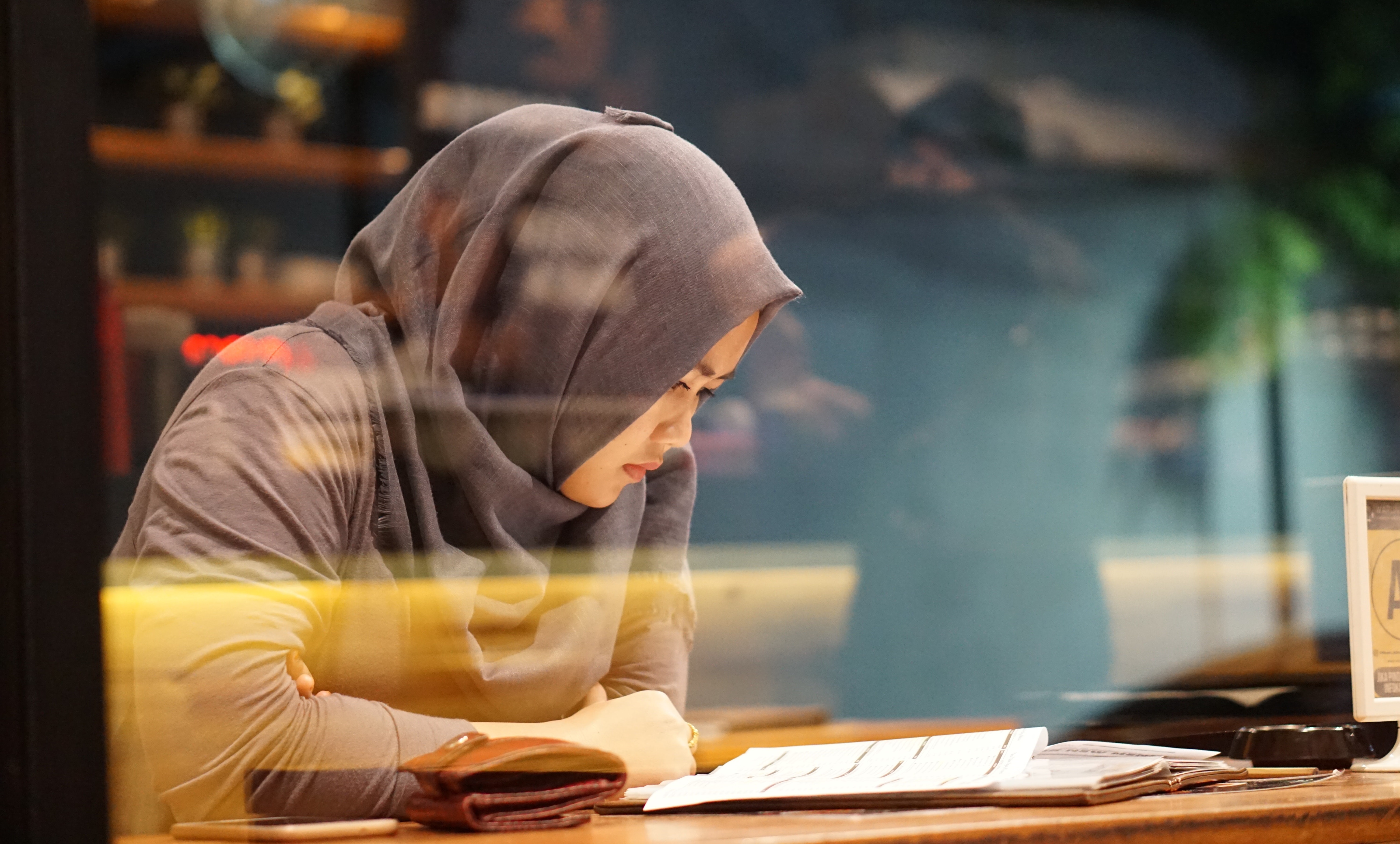 Woman reading a piece of paper