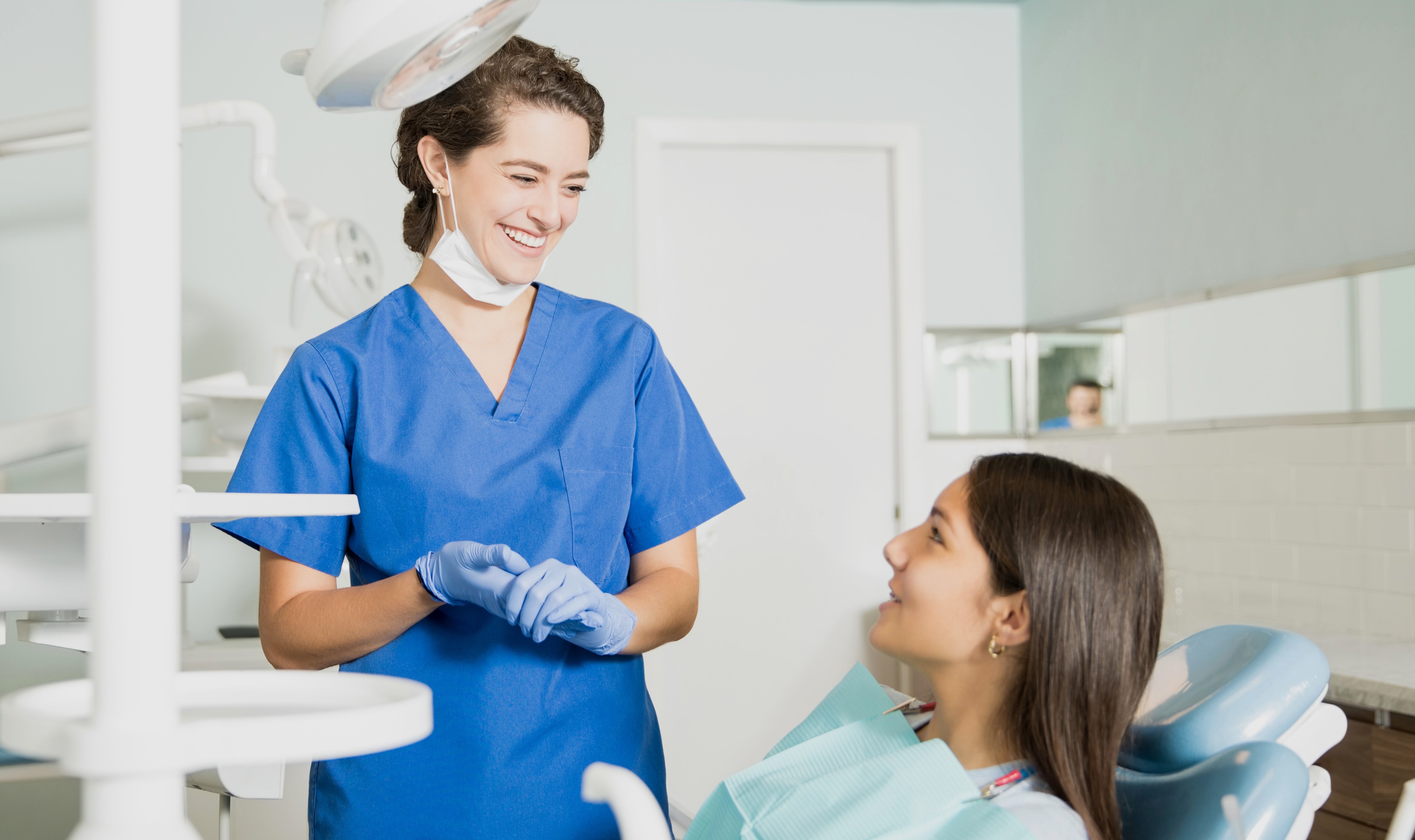 dentist talking to her patient